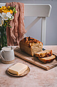 Corn bread, butter and milk on a table, served for breakfast