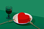 Generative AI crafted image depicting a Valentineâ€™s Day dinner with a heart-shaped object on a plate and an elegant glass.