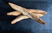 Traditional Georgian bread known as a tonis puri on concrete table