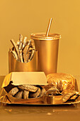 Golden street food placed on a table against a golden background