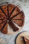 Top view of chocolate cake sliced on transparent plate