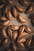 From above box with healthy dumplings in rustic style for cooking lunch