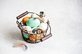 From above basket with easter card concept with eggs on concrete background