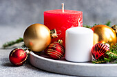 Holiday interion set with candles and fresh fir tree branches