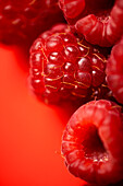 From above fresh sweet red raspberries arranged together representing concept of healthy diet