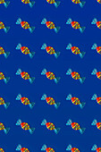 Top view of pattern of whole sweet crystal candies arranged on blue background