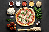 Generative AI illustration top view flat lay of appetizing homemade Italian margarita pizza with basil leaves tomatoes and spices laid out on black background