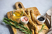 From above cooking food concept with rosemary herb and salt-pepper spice