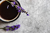 Top view of espresso coffee with lavender on concrete background