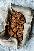 Wooden box full of fresh baked chocolate cookies on the concrete background