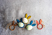 From above flat lay with eggs for Easter holiday concept on concrete background