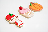 Appetizing baked cookies for Christmas and Halloween celebrations on white background in bakery