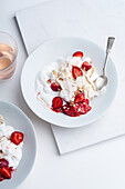 Dessert with berries, meringue and whipped cream. Eton's mess with strawberries, sweet treat with summer mood