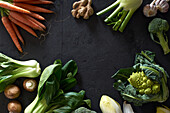 Food concept, flat lay with fresh fruits and vegetables on dark background