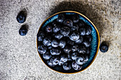 From above ripe blueberries in the bowl as a healthy food concept