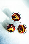 Overhead view of winter mulled wine with spices on concrete background