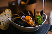 Delectable mussels with herbs in bowl
