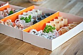 Stock photo of take away sushi boxes in japanese restaurant.