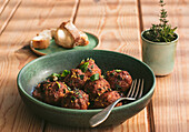 Closeup of a plate of meatloaf with some parsley