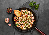 Top view shrimp scamp in a pan on grey background