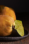 Fresh whole sour yellow lemons on wooden background