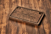 From above scratched chopping board placed on rustic lumber table