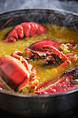 Typical Spanish fideuá with red prawns in cooking pot