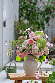 Bouquet of autumn anemones (Anemone Japonica), fennel blossoms, roses (pink), hydrangea 'Annabell' in jug