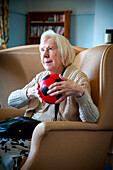 Care home resident taking part in exercise class