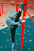 Woman stretching in park