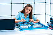 Scientist working with multi-axis machining