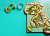 Grilled flatbread with feta cream, spring onions and chilli