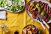 Flank steak with roast potatoes and cucumber salad