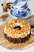 Chocolate wreath cake with salted pretzels and caramel