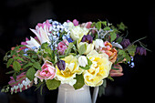 Bouquet of spring flowers with tulips and checkerboard flowers (Fritillaria meleagris)