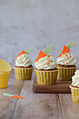 Carrot cupcakes with candied orange peel and cream cheese cream for Easter