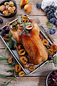 Roast duck with plums and herbs