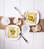 Crêpes parcels with fried egg and peas
