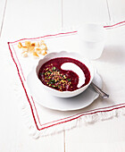 Beetroot soup with sour cream and herbs