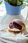 Sweet buns with jam and cream filling