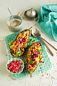 Aubergine stuffed with couscous and pomegranate seeds