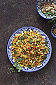Couscous salad with sultanas, peanuts and herbs
