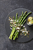 Green asparagus with goat's cheese, walnuts and herbs