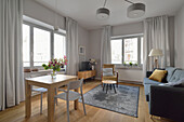 Brightly furnished living room with dining area in a flat in Nowa Praga, Warsaw