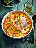 Root vegetable gratin with parmesan and salmon