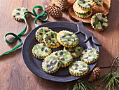 Christmas biscuits with fondant camouflage pattern