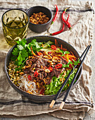 Vietnamese bun bo nam bo with beef and rice noodles