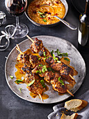 Savoury pork skewers with herbs and dip