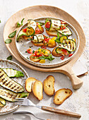 Crostini with grilled courgettes, tomatoes, garlic and fresh mint