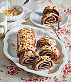 Gingerbread roll with plum jam and nuts
